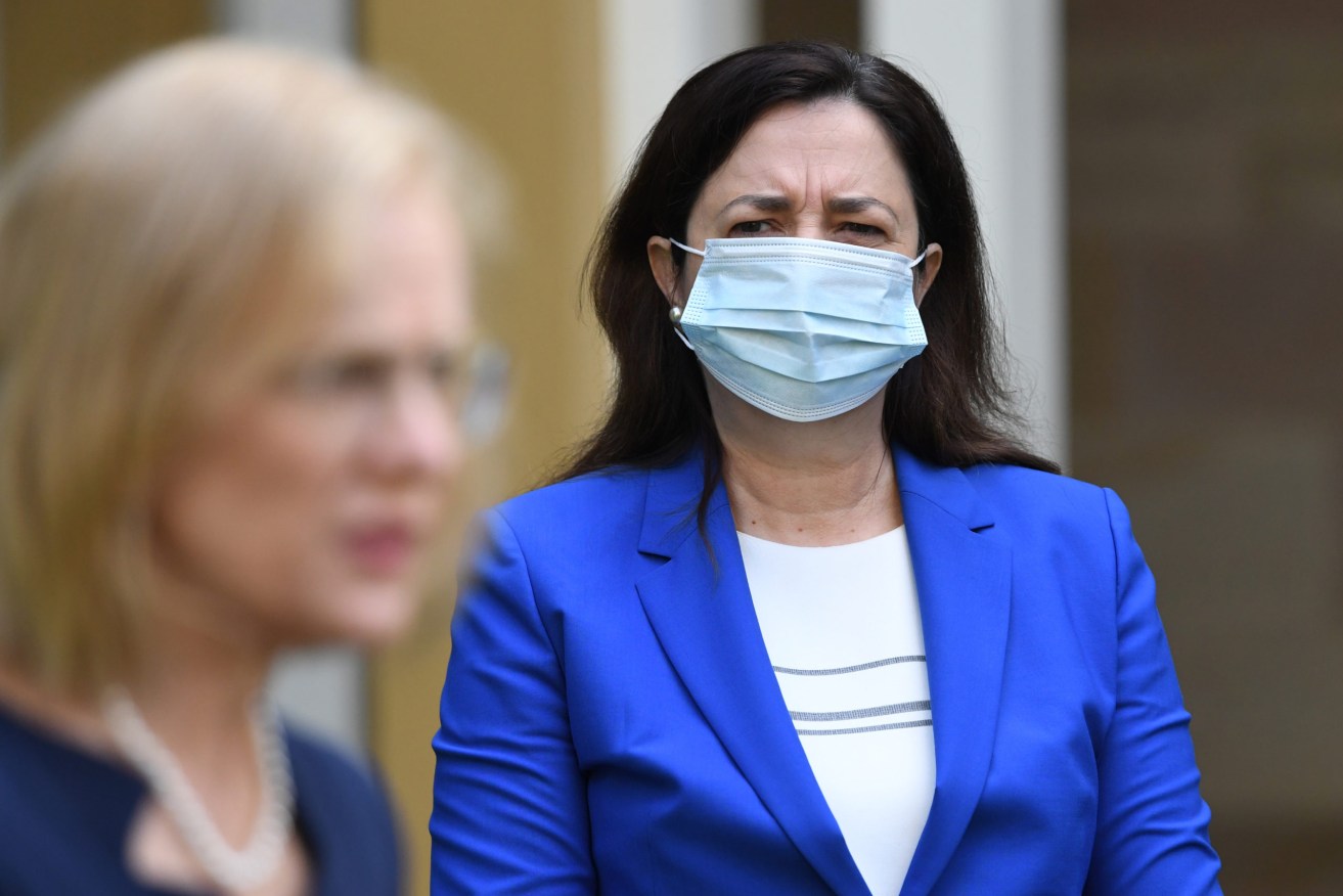 Queensland Premier Annastacia Palaszczuk (right) and former Chief Health Officer Dr Jeannette Young may have been a factor in Queensland's Covid success (AAP Image/Darren England) 