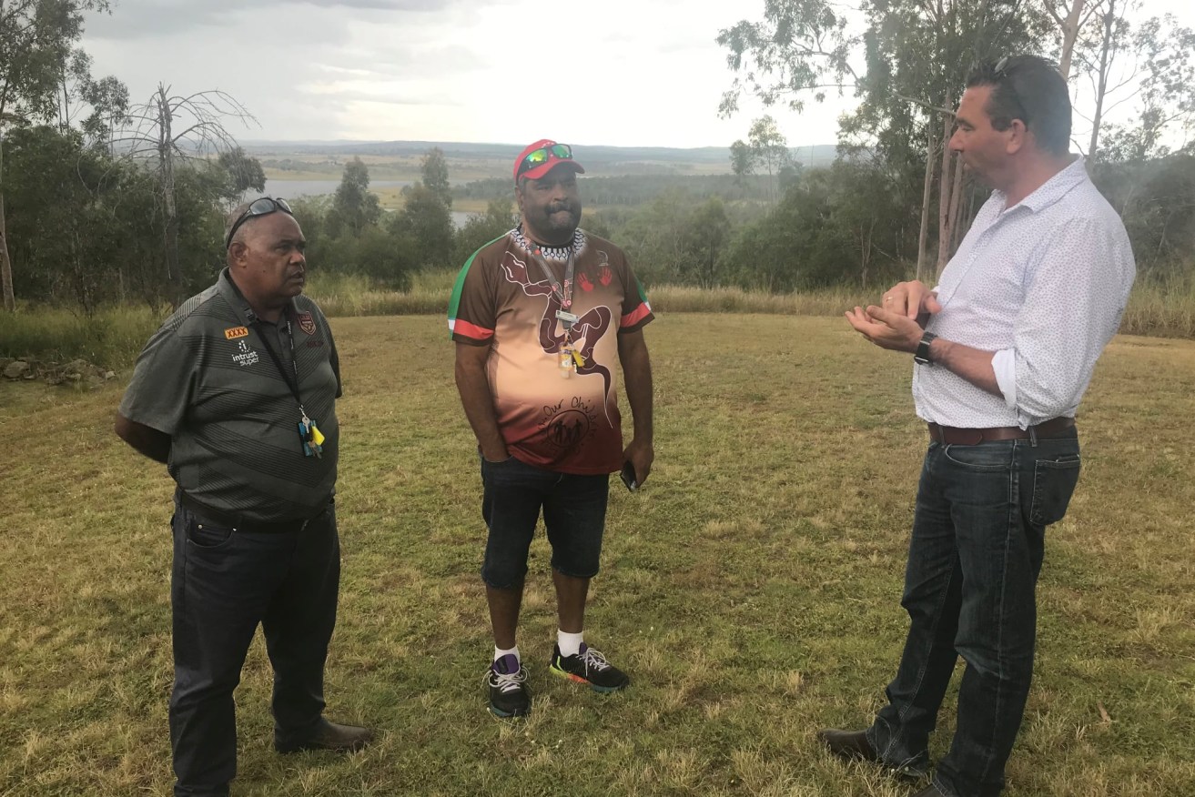 Aboriginal and Torres Strait Islander Partnerships Minister Craig Crawford (right) talking with Fred Cobbo and Barry Fewquandie in Cherbourg. (Supplied)