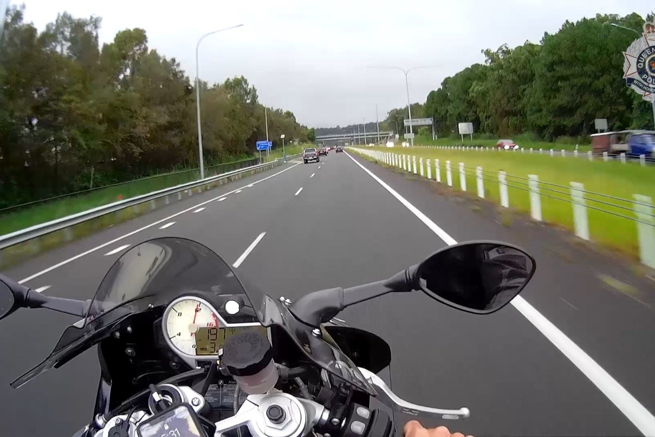 Police recently released footage from a motorcycle rider's helmet camera showing him travelling at almost 200km/h on the Sunshine Coast Motorway. He survived but was fined more than $17,000. (AAP Image/Supplied by Queensland Police) 