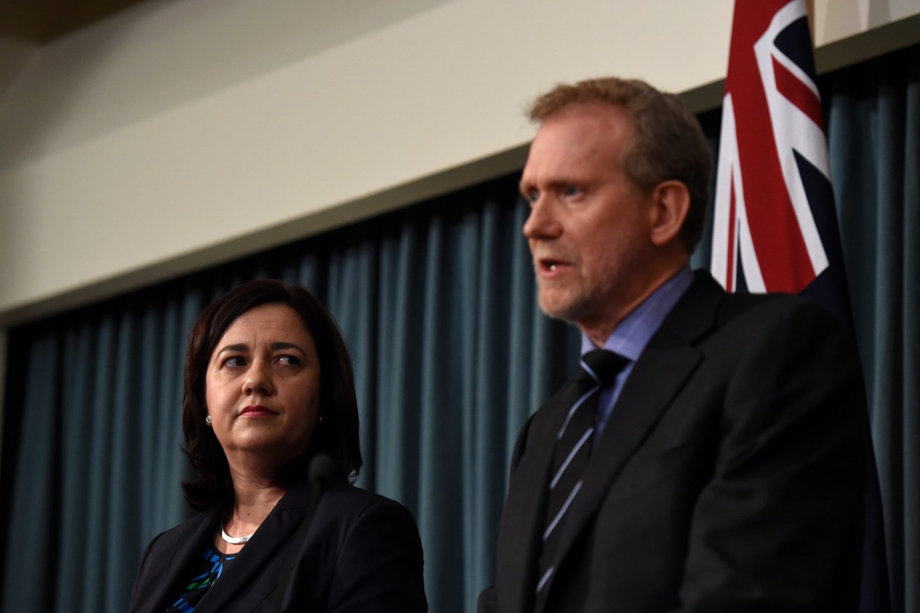 Premier Annastacia Palaszczuk photographed with Crime and Corruption Commissioner Alan MacSporran, who says Queensland's secrecy laws pose a "corruption risk" around the Brisbane 2032 Olympics. (AAP Image/Dan Peled) 