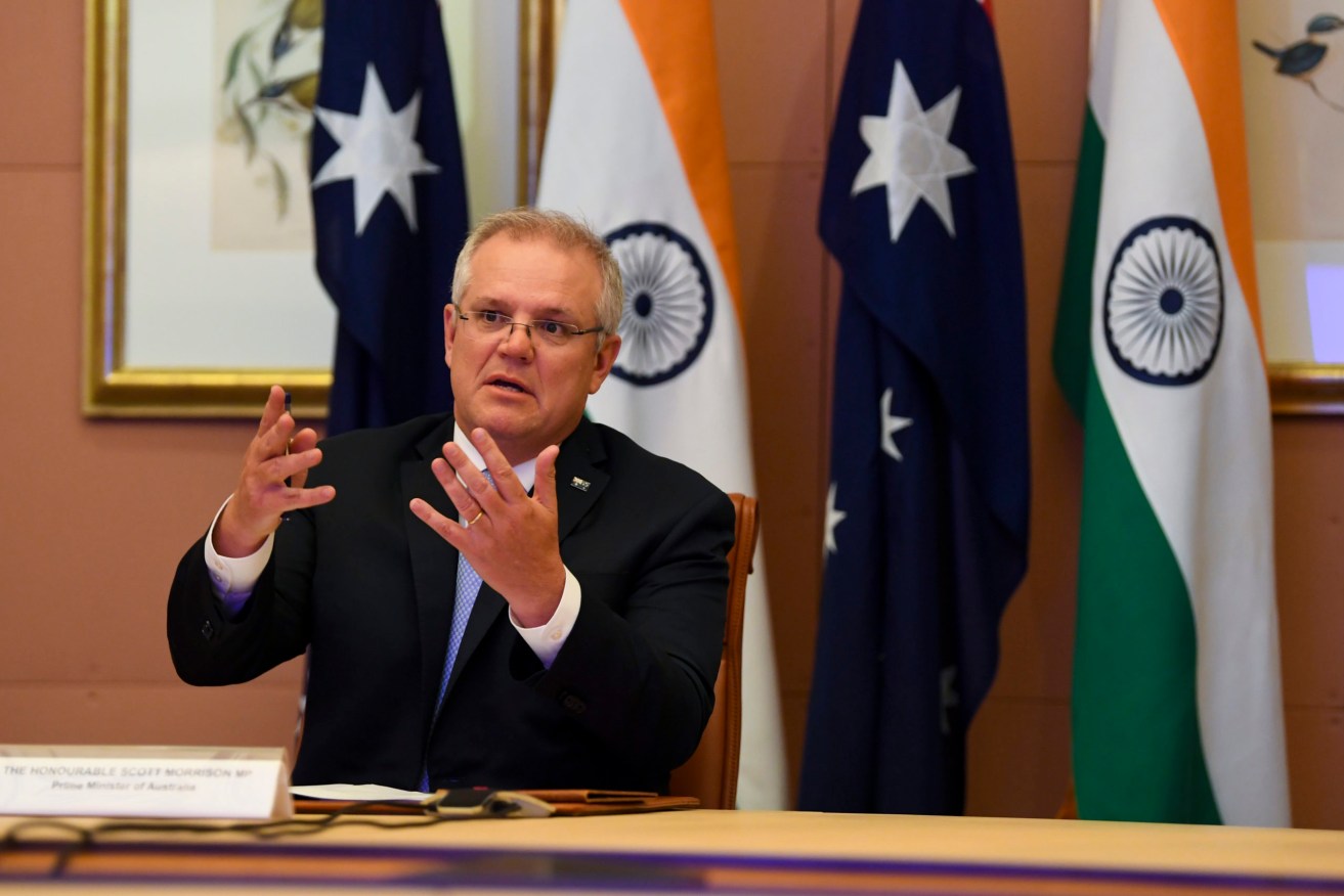 Prime Minister Scott Morrison at last year's virtual leaders summit with India. Photo: AAP Image/Lukas Coch