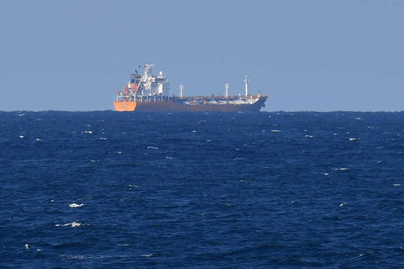 The Inge Kosan is seen anchored off the coast of the Sunshine Coast Photo: AAP/Darren England) 