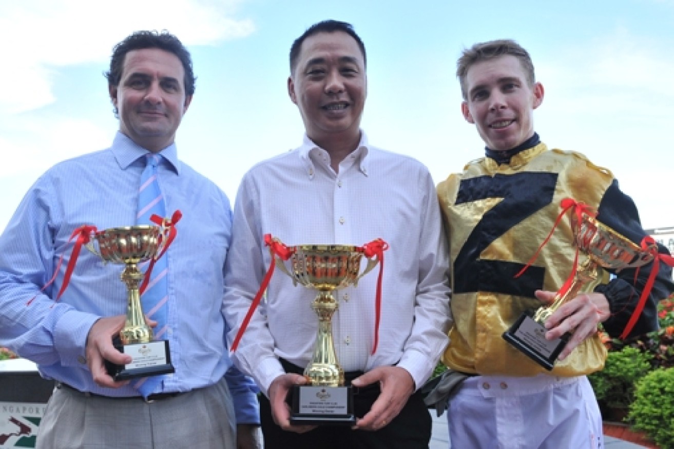 Dr Wong Yew Choy (centre) has enjoyed success on the track at the Singapore Turf, but allegedly has reneged on a $43 million gambling debt with Star Gold Coast (Pic, Singapore Turf Club)