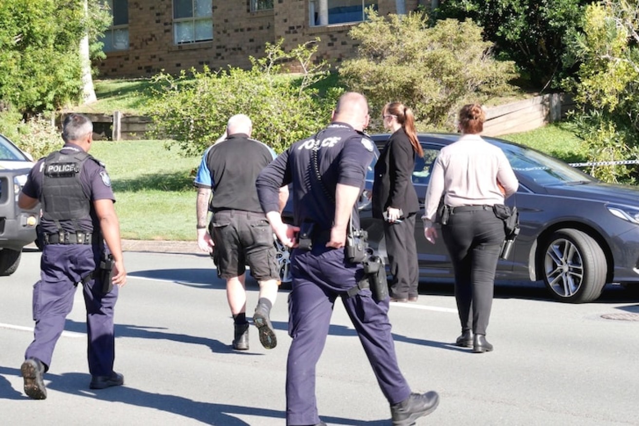 Detectives and uniformed officers arrive at the crime scene (ABC Photo)