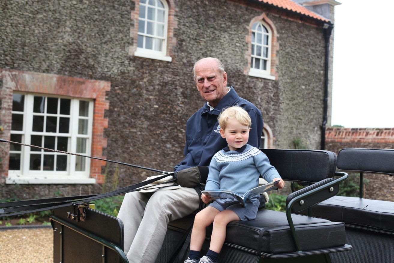 Prince Phillip with his great grandson, Prince George, in a photo released by Buckingham Palace this week.