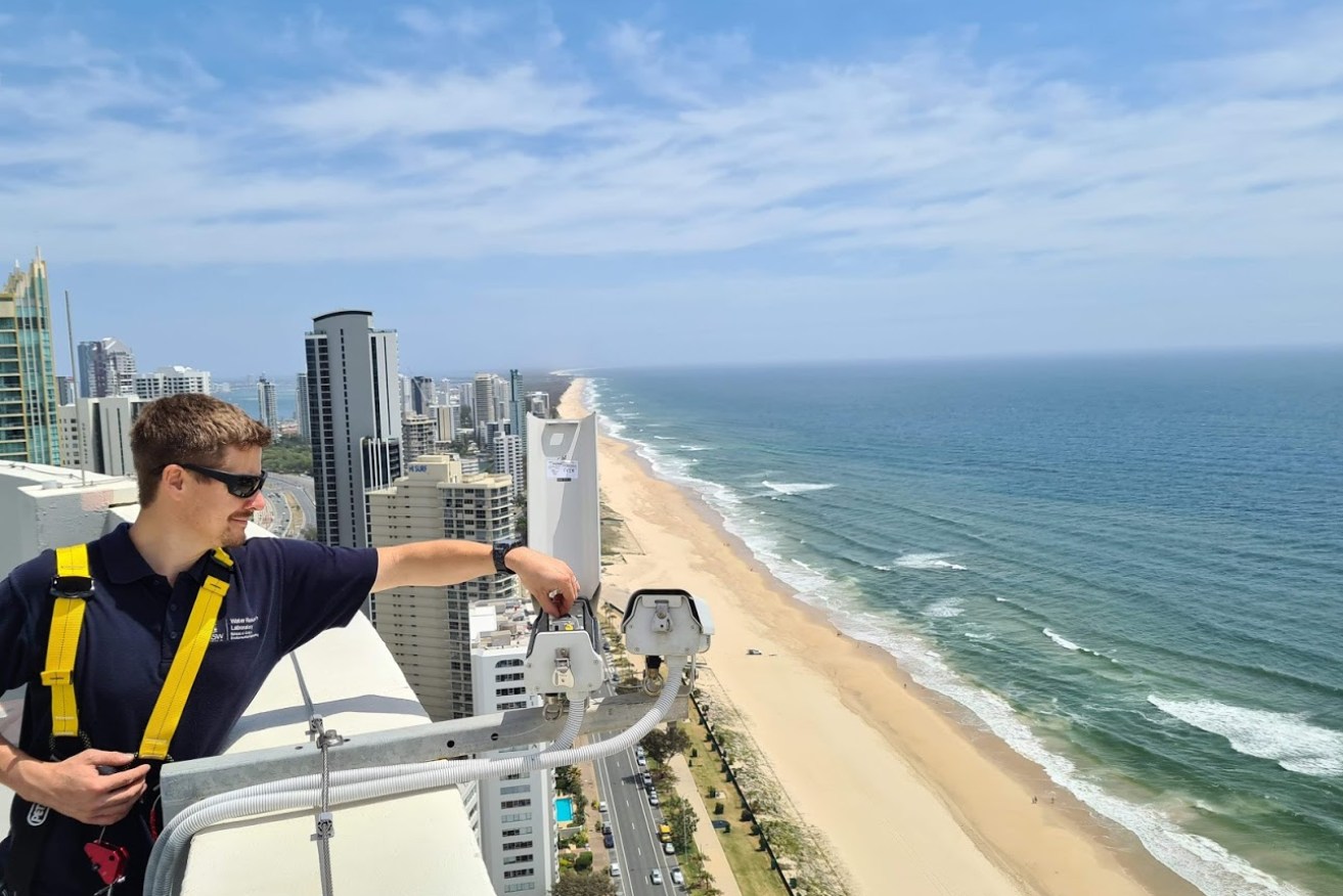 Engineer Chris Drummond adjusts part of the world-leading beach monitoring system now protecting Gold Coast beaches (Photo: Geoplex)