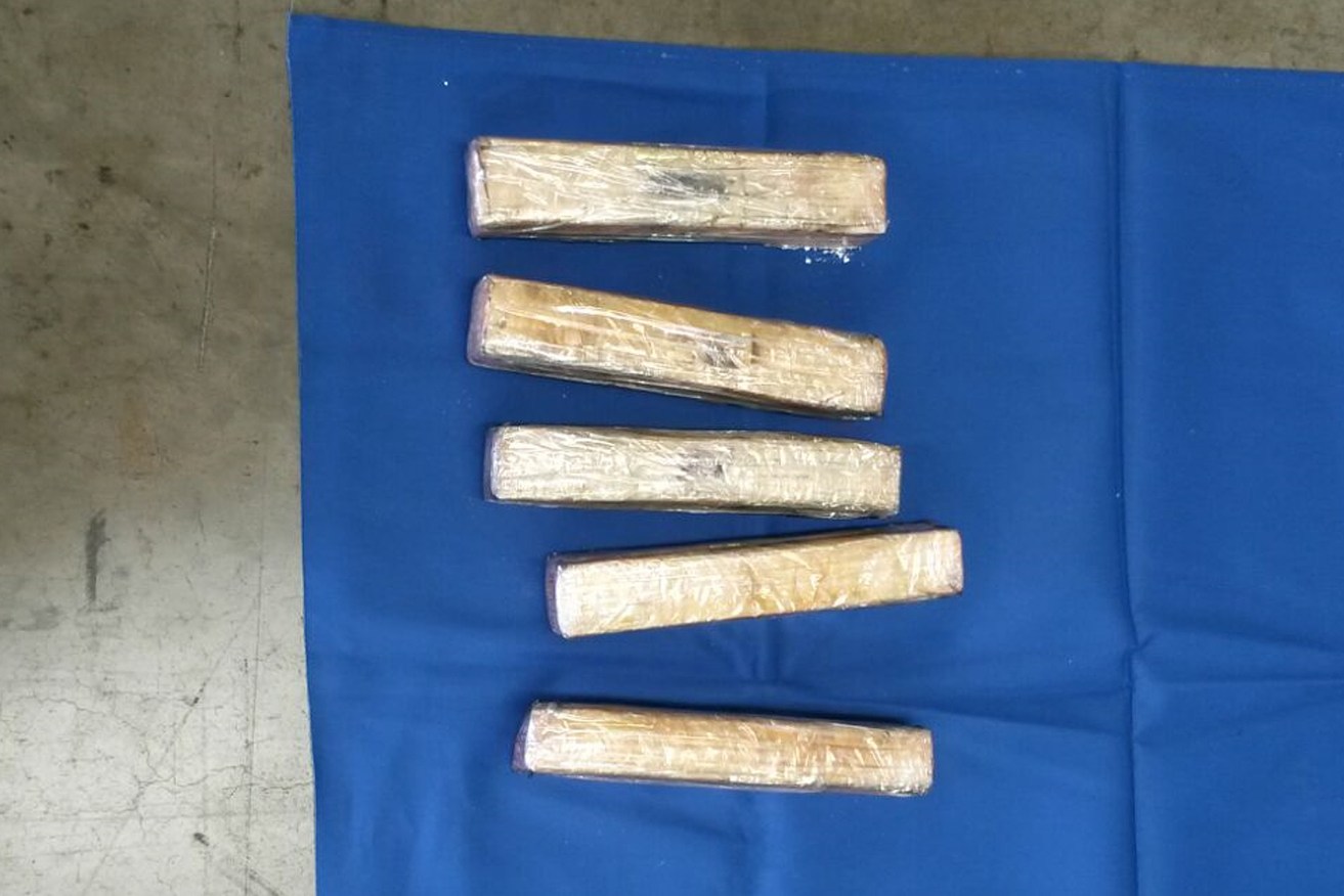 Australian Border Force officers discovered 99 bricks of cocaine hidden in a shipping container from Colombia. Photo: ABF