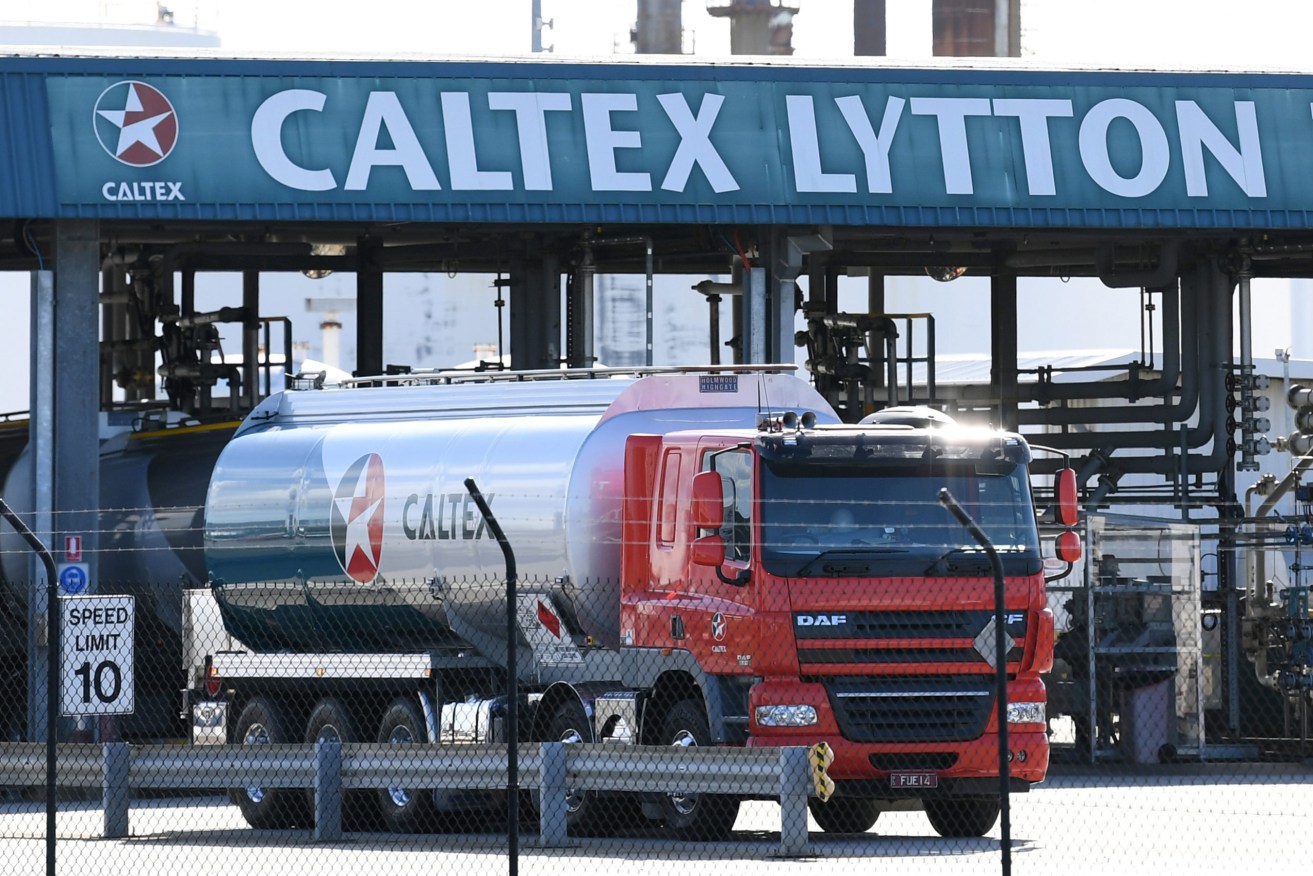 A fuel tanker is seen at the Caltex refinery in Brisbane. Federal excise is to be reapplied to fuel, pushing up bowser prices. (AAP Image/Dan Peled) 