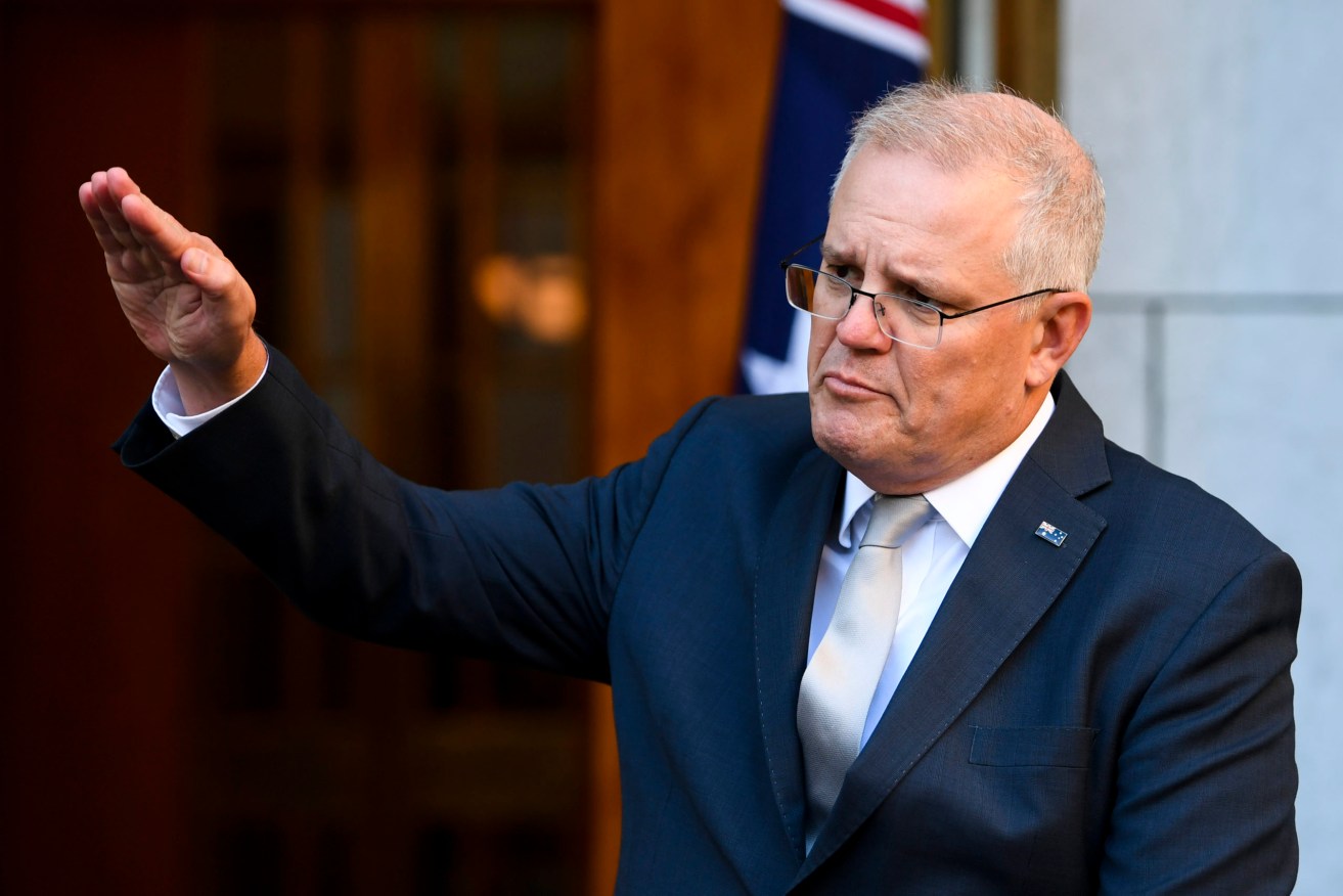 Australian Prime Minister Scott Morrison expects repatriation flights from India to resume next week. (AAP Image/Lukas Coch) 