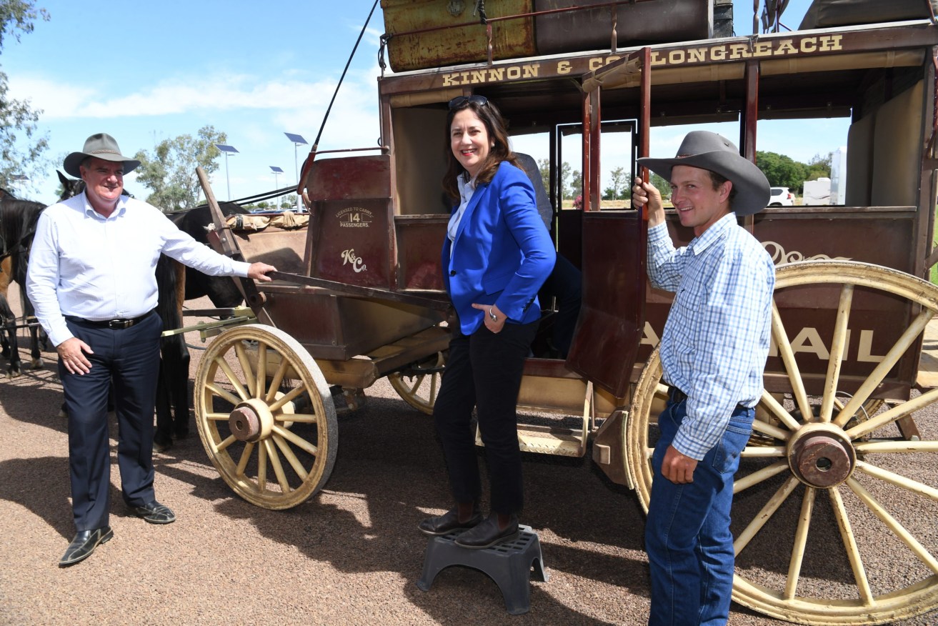 Queensland Premier Annastacia Palaszczuk arrives by a horse drawn stagecoach at the Australian Stockman's Hall of Fame in Longreach. Photo: AAP/Darren England