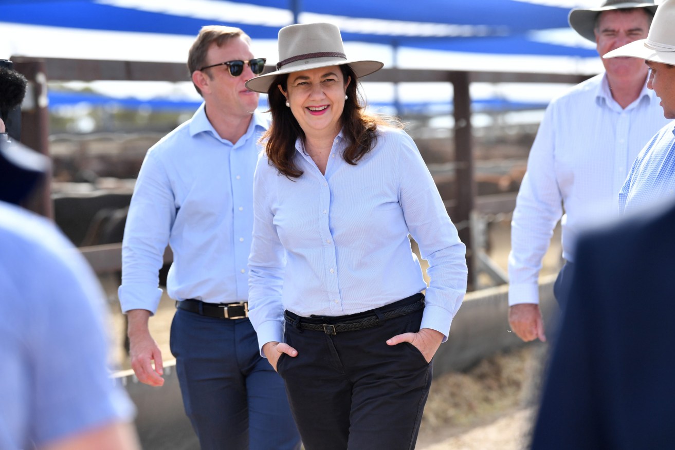 Queensland Premier Annastacia Palaszczuk (centre) is seen at the Longreach saleyards on Tuesday, where State Cabinet met as part of her tour of regional Queensland. (AAP Image/Darren England)