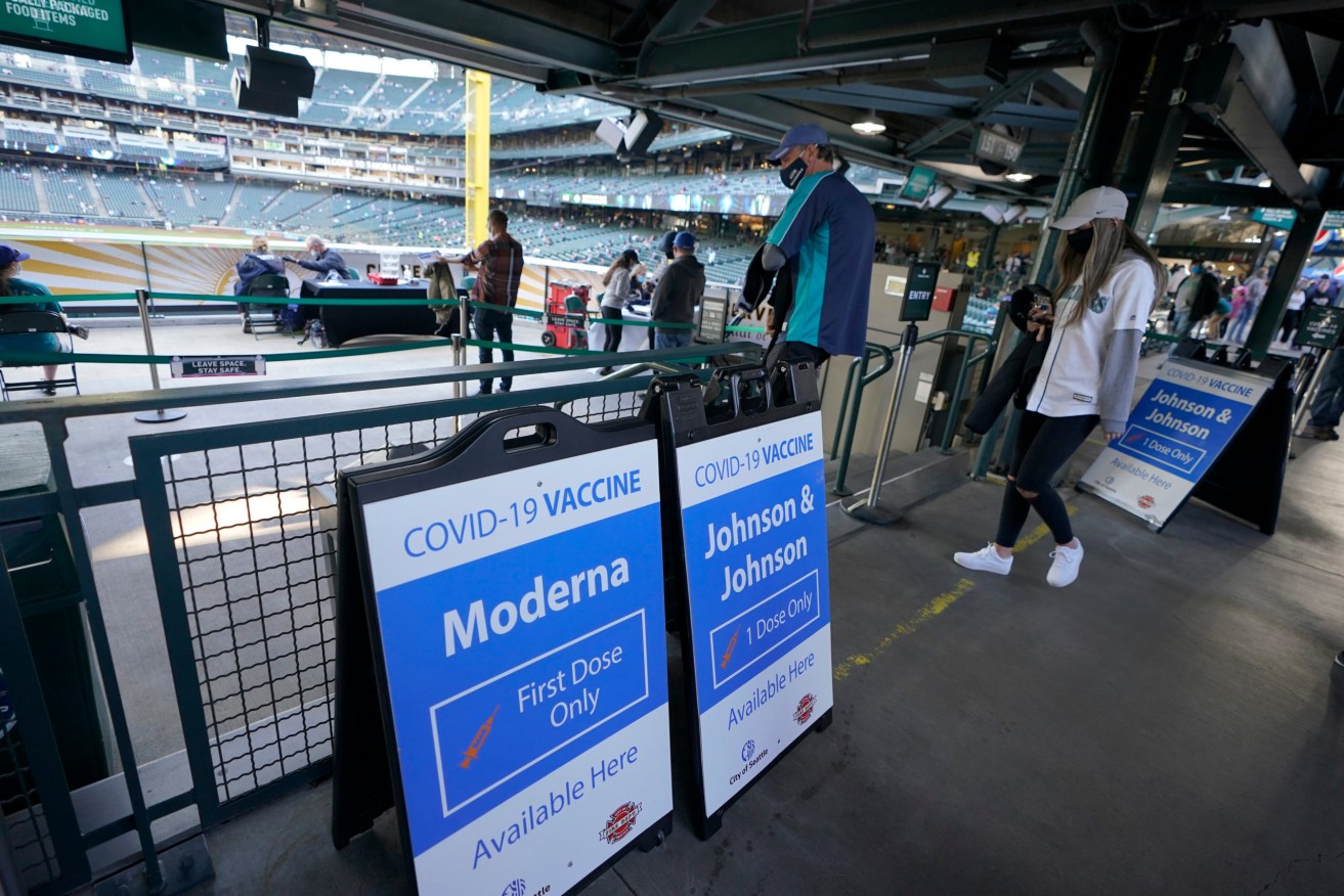 The Moderna vaccine has been effective at mass-vaccination sites across the US, such as the Seattle Mariners baseball park where attendees are offered free vaccines while they attend matches. (AP Photo/Ted S. Warren)