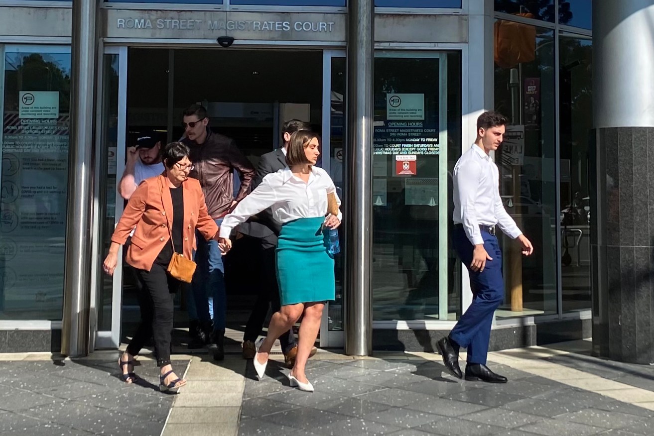 The victims family leave Brisbane Magistrates Court. (AAP Image/Robyn Wuth) 
