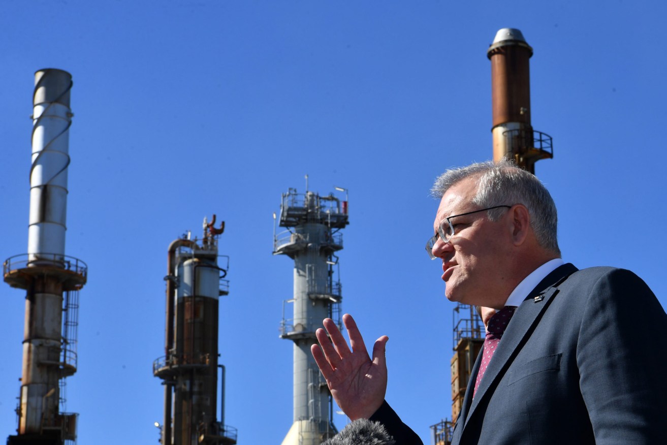 Prime Minister Scott Morrison the Ampol Lytton Refinery in Brisbane, which has staged a remarkable turnaround in the past 12 months.  (AAP Image/Darren England) 