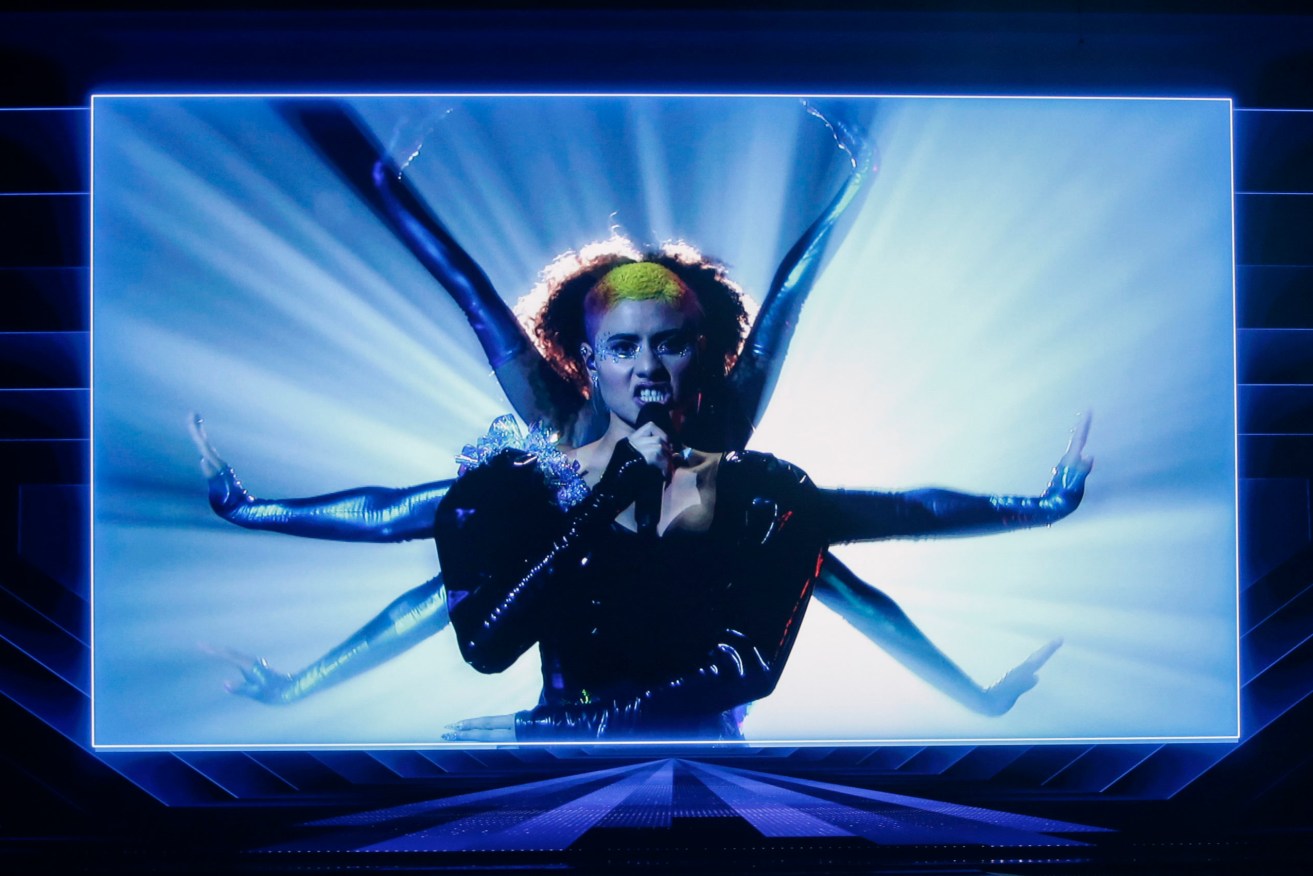 A pre recorded performance by Montaigne from Australia is shown on a video screen at the first semi-final of the Eurovision Song Contest in Rotterdam. (AP Photo/Peter Dejong)