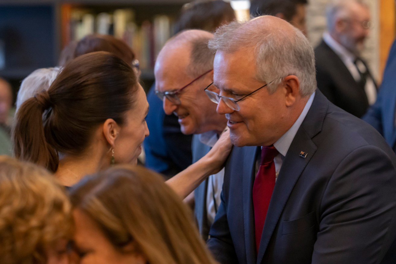 Australian Prime Minister Scott Morrison and New Zealand Prime Minister Jacinda Ardern hongi during the Powhiri (traditional Maori greeting) at the annual Australia-New Zealand Leaders' Meeting at  the Rees Hotel in Queenstown. (AAP POOL Image/Peter Meecham) 