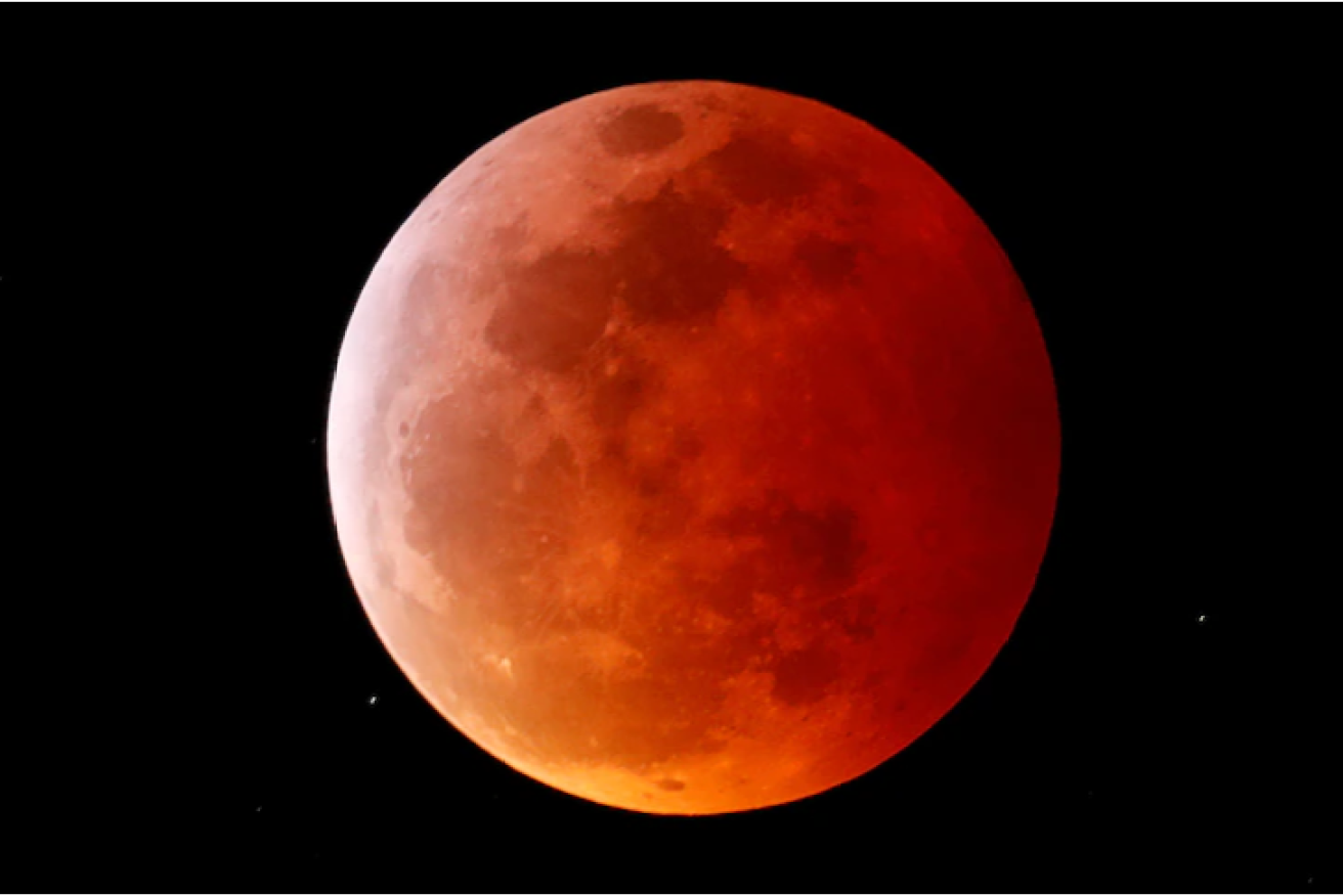 Queenslanders should enjoy perfect viewing conditions for tonight's rare super blood moon, similar to this one in 2019, which should be visible from about 8.40pm (Photo: AAP)