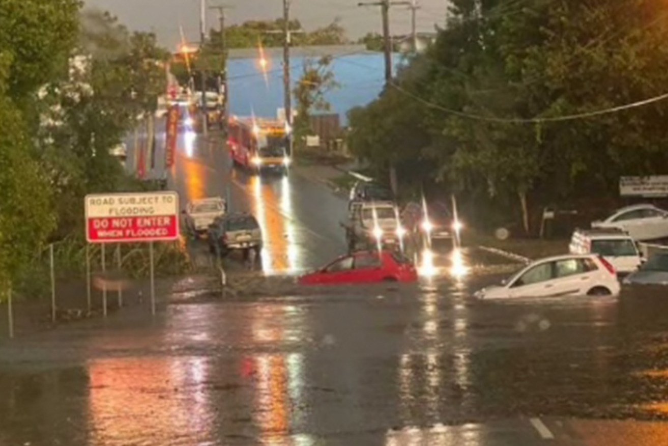 Flooded Station Road at Yeerongpilly on Brisbane's southside on Wednesday evening (Image: ABC - Lucy Campbell)