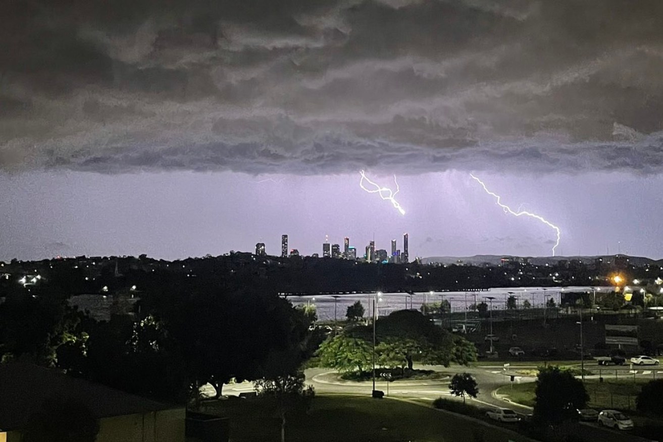 Lightning strikes over Brisbane early Tuesday morning. Photo: Alan Nolan/Twitter