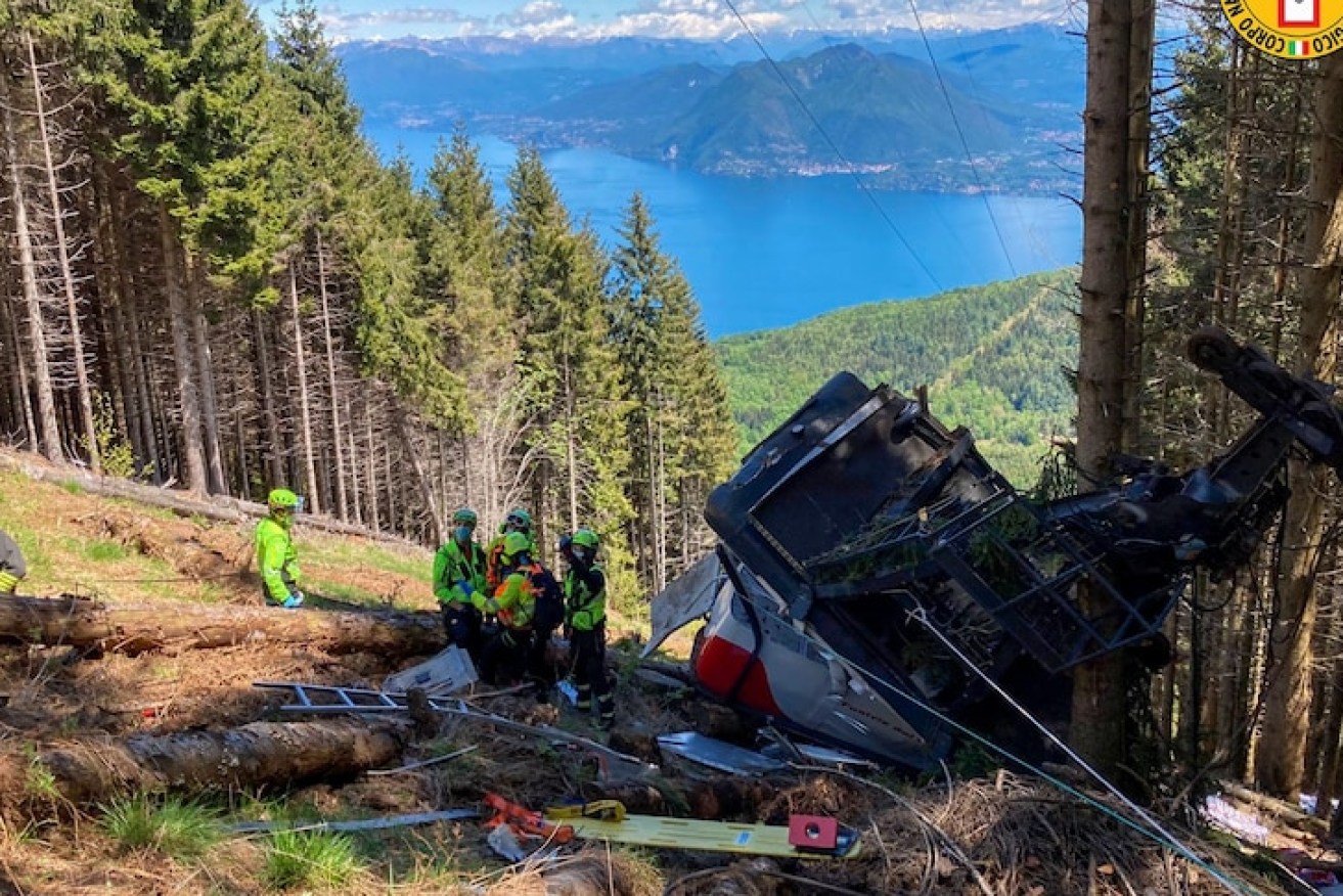 At least 14 people are dead after a cable car fell to the ground in northern Italy. (AP PHOTO)