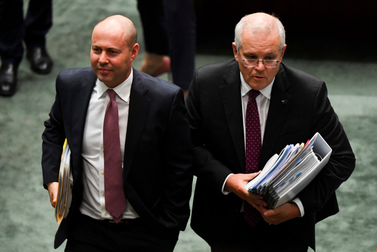 Prime Minister Scott Morrison and Treasurer Josh Frydenberg leave during House of Representatives Question Time at Parliament House. (AAP Image/Lukas Coch) 