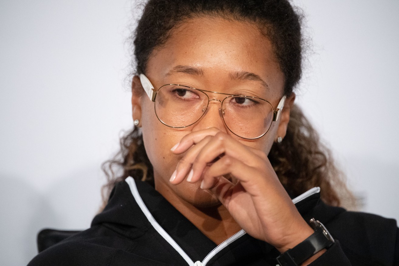 Japanese tennis player Naomi Osaka reacts during a press conference at the Stuttgart Open tennis tournament at the Porsche-Arena. Osaka has announced her withdrawal from Roland Garros. Photo: Marijan Murat/dpa