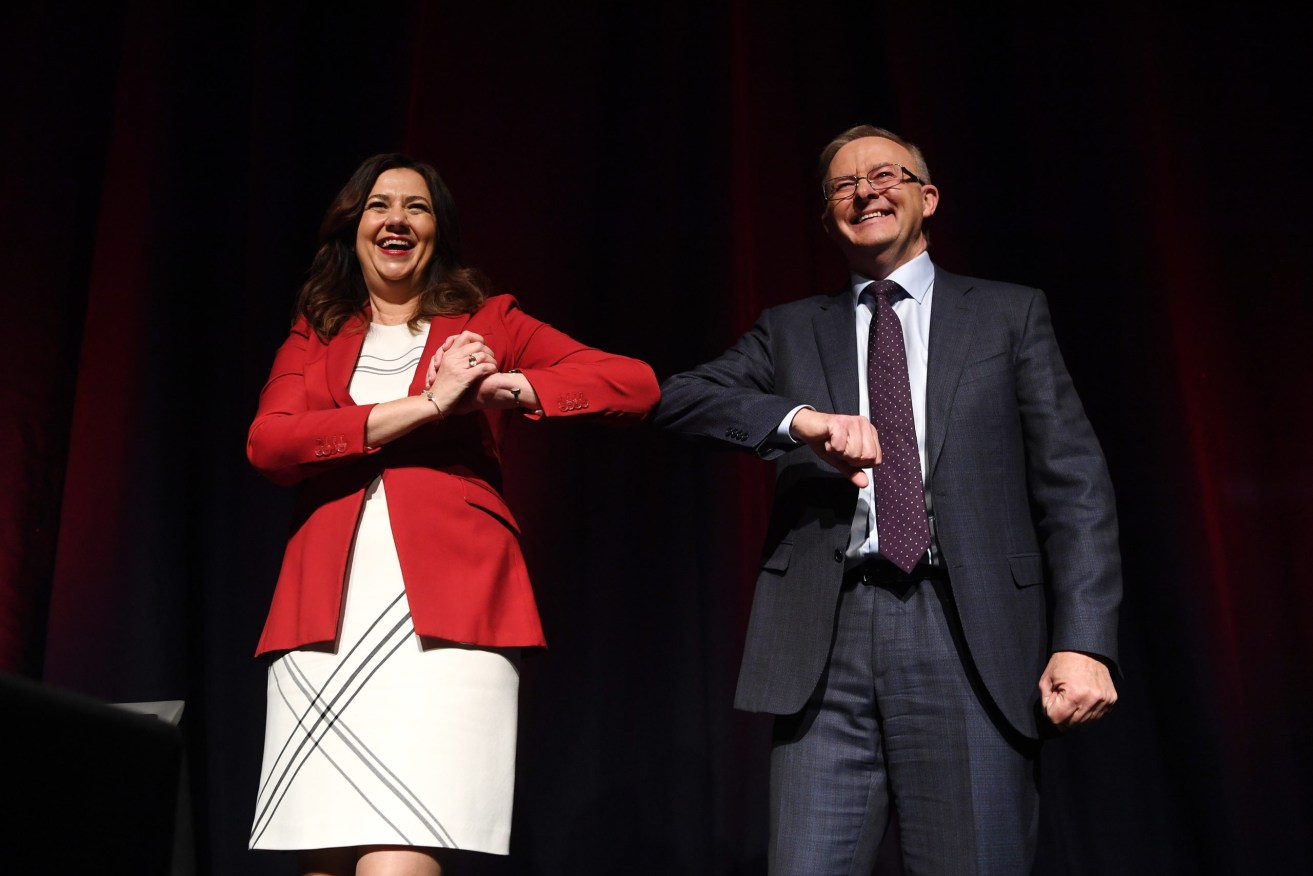 Federal Opposition Leader Anthony Albanese and Queensland Premier Annastacia Palaszczuk elbow-bump at the recent Queensland State Labor Conference, where government figures mingled with lobbyists and donors. (AAP Image/Dan Peled)