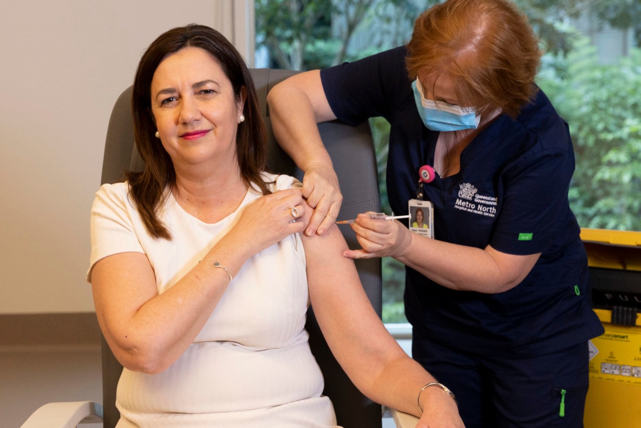 Queensland Premier Annastacia Palaszczuk is given her COVID-19 vaccination by clinical nurse Dawn Pedder at the Surgical Treatment Rehabilitation Service Centre in Brisbane. (AAP Image/Sarah Marshall, Newscorp Pool)