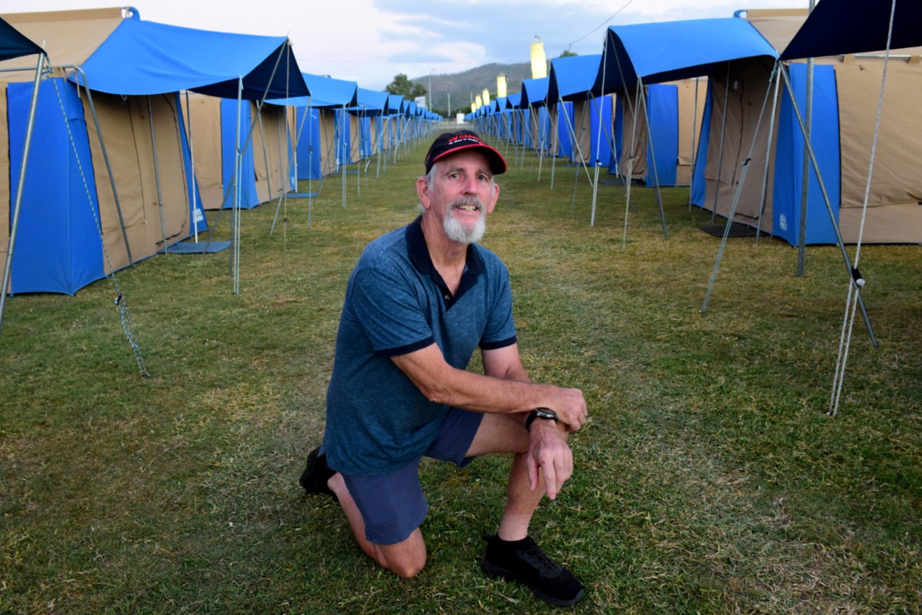 Richard Whitmore of Tent City Hire in Gympie at the “Footy Basecamp” tent accommodation facility, Endeavour Park. About 100 tents have been erected to boost Townsville's accommodation options ahead of the Wednesday’s State of Origin match.  (AAP Image/Scott Radford-Chisholm) 