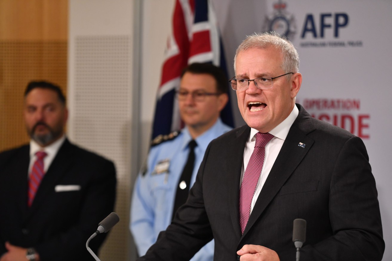 Prime Minister Scott Morrison briefs media on Operation Ironside, which has disrupted organised crime internationally. (AAP Image/Dean Lewins)
