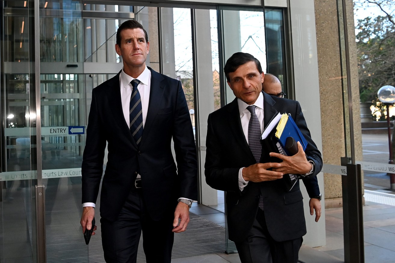 Ben Roberts Smith (left) is suing three former Fairfax newspapers over articles he says defamed him in suggesting he committed war crimes in Afghanistan between 2009 and 2012. (AAP Image/Bianca De Marchi)