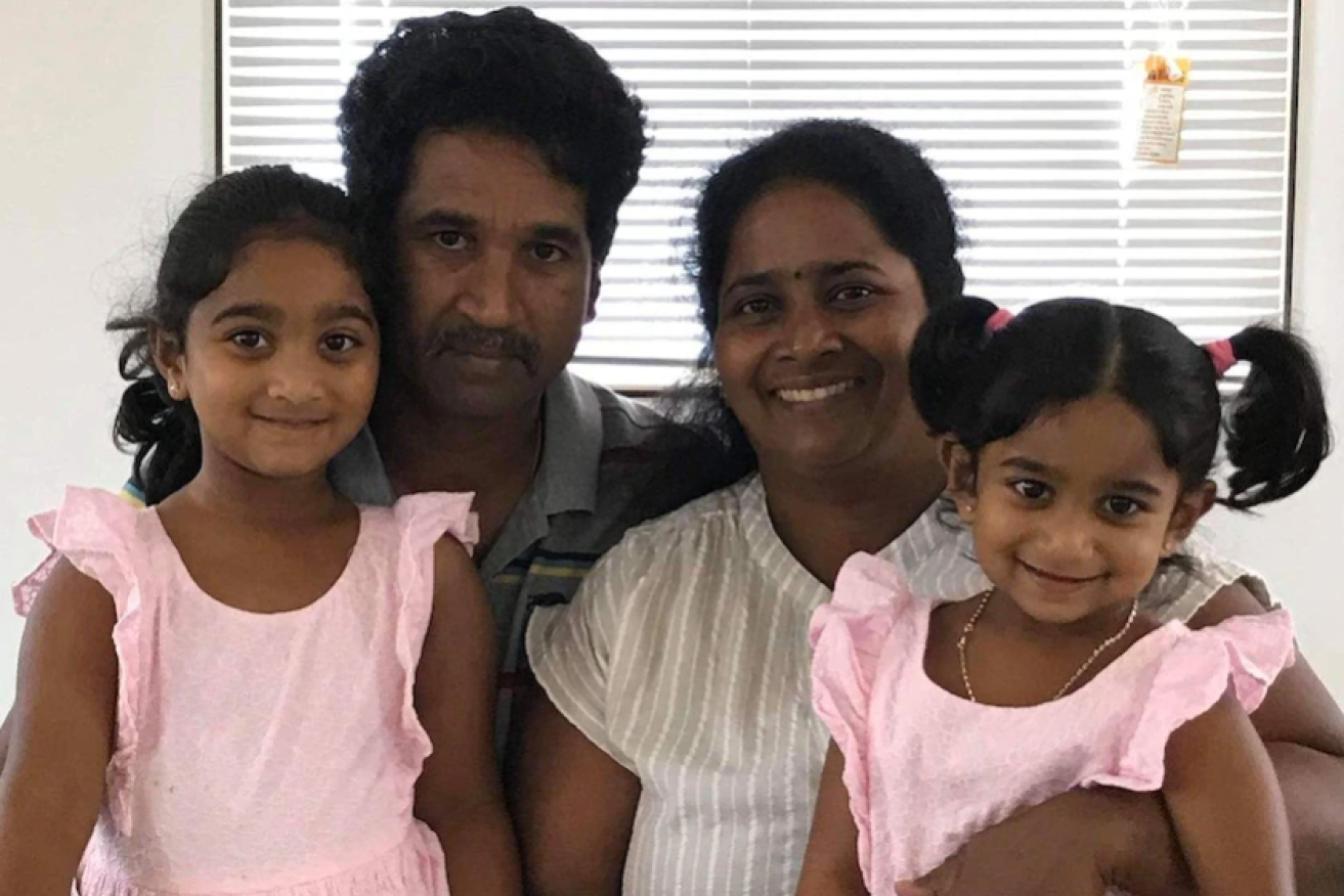 Nades and Priya with their Australian-born daughters Kopika and Tharnicaa.(Supplied: Angela Fredericks)