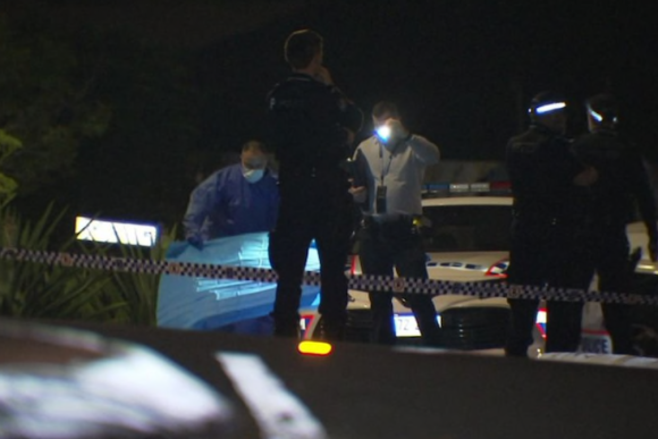 Police at the scene of Wednesday night's fatal stabbing in Newmarket. A woman will face court charged with murder (Photo:ABC).