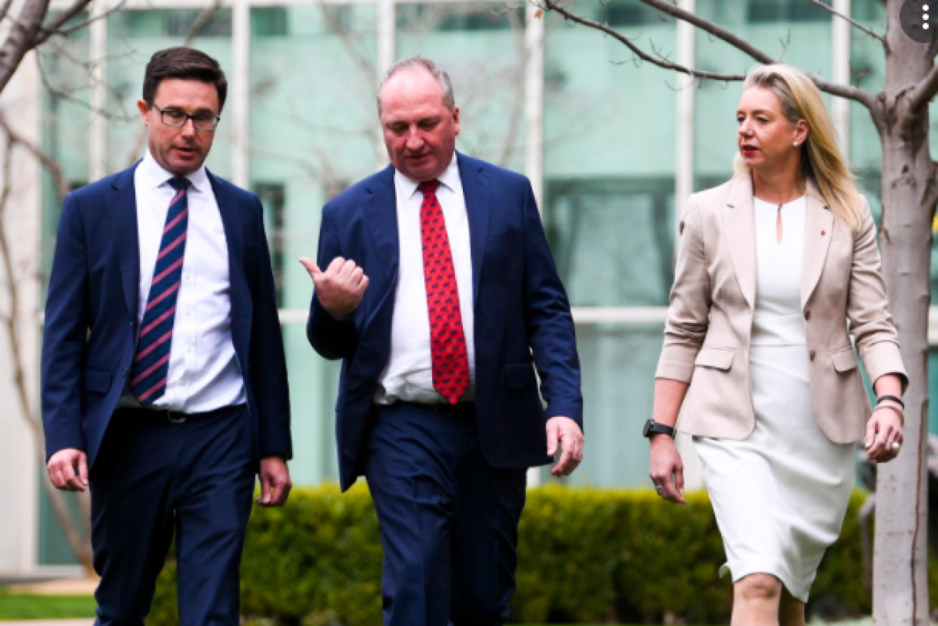 Barnaby Joyce, flanked by Nationals Deputy Leader David Littleproud and newly re-installed Cabinet Minister Bridget McKenzie.(AAP Image).