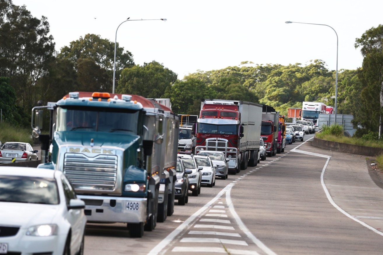 The Queensland border remains open to NSW, subject to restrictions, but truck drivers have been ordered to lift their game. (AAP Image/Jason O'Brien) 