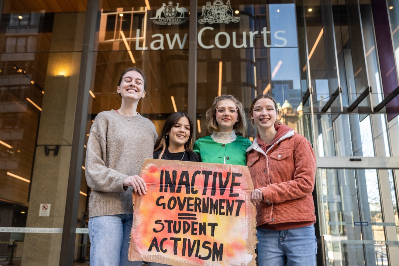 Laura Kirwin, Izzy Raj-Seppings, Ava Princi and Liv Heaton outside The Federal Court of Australia in Sydney, where they were among eight young Australians who sought an injunction to prevent Environment Minister Sussan Ley from approving the Vickery coalmine extension. (AAP Image/James Gourley) 