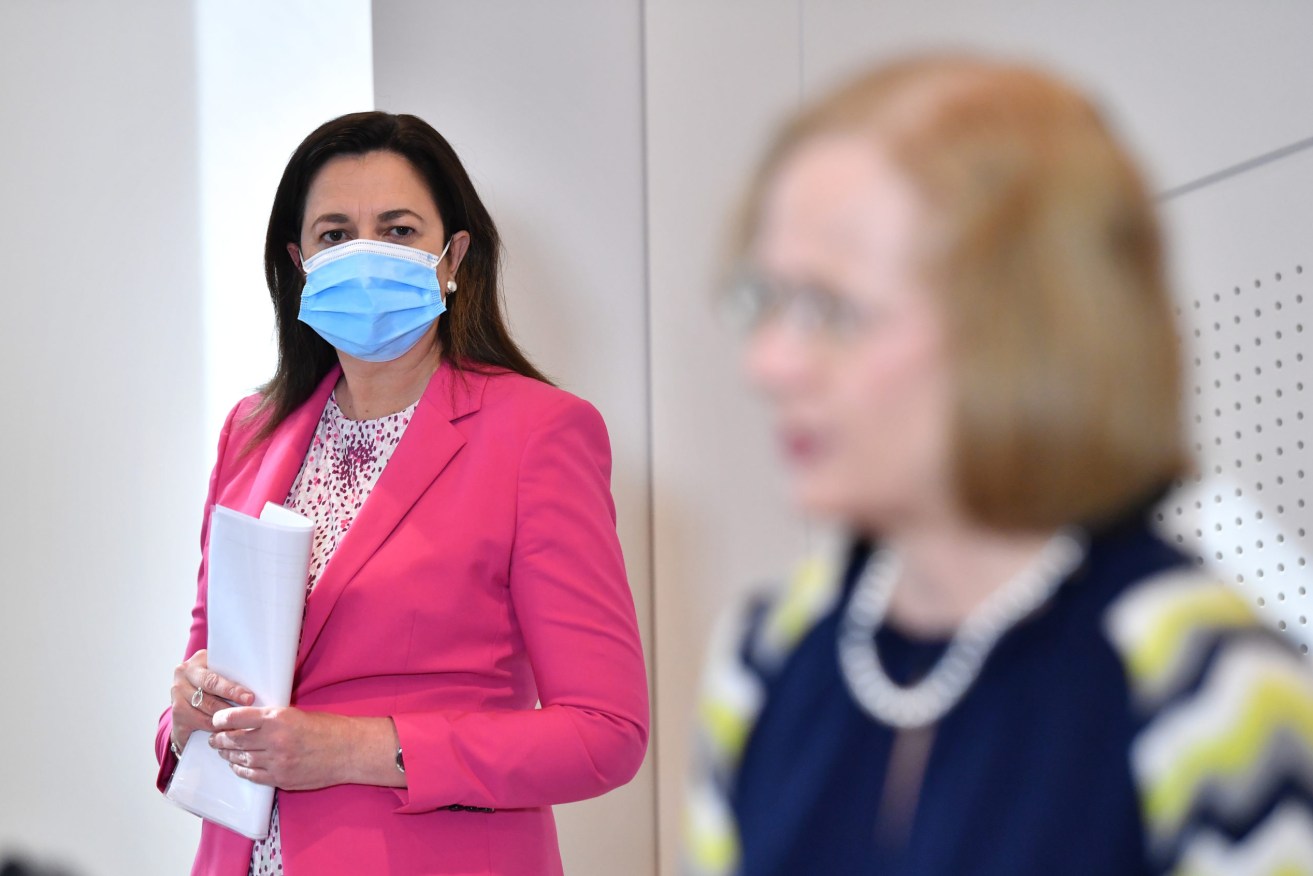Queensland Premier Annastacia Palaszczuk (left) looks on as Queensland Chief Health Officer Dr Jeannette Young (right) addresses the media during a press conference in Brisbane.(AAP Image/Darren England) 