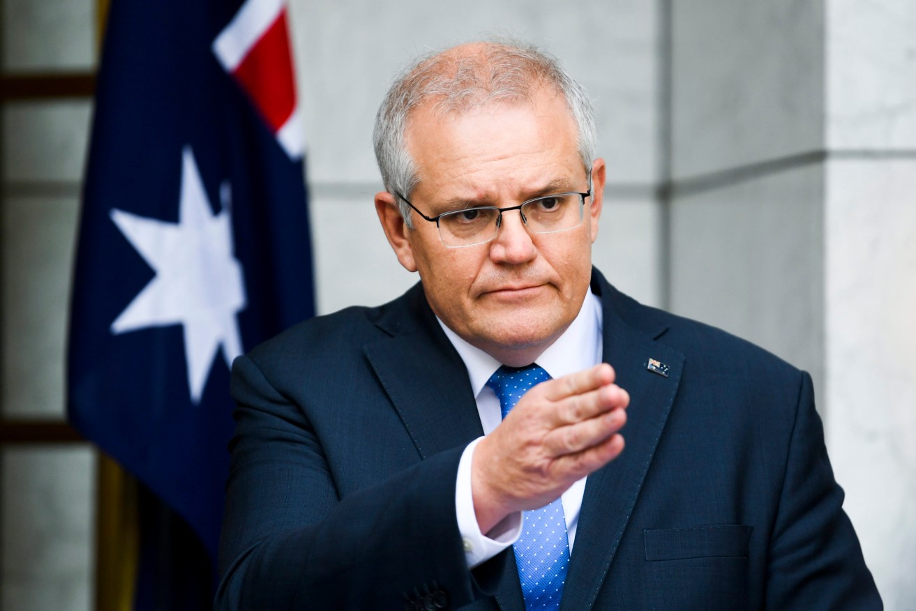 Prime Minister Scott Morrison has called in the national security committee to discuss sanctions against Russia. (AAP Image/Lukas Coch)