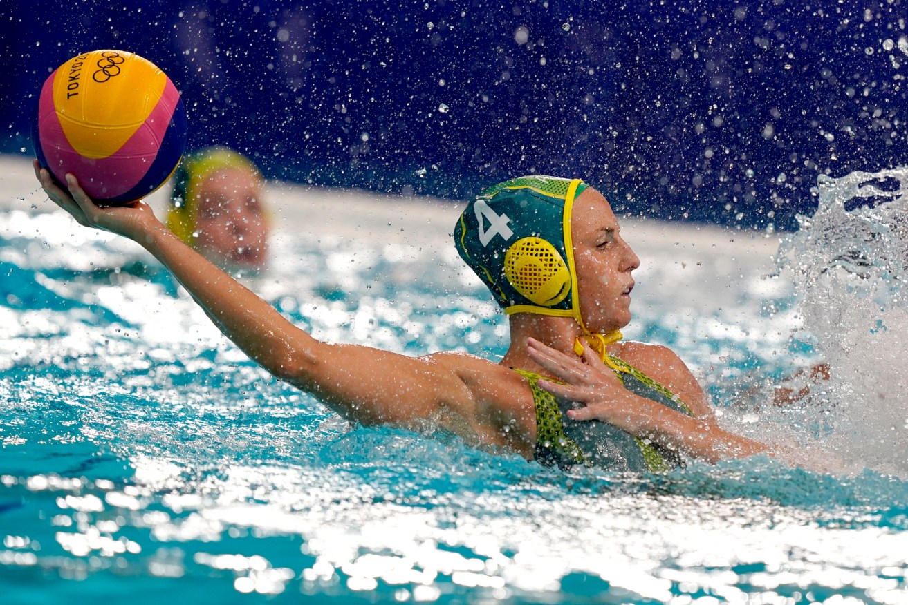 Australia's Bronte Halligan (4) protects the ball from a defender . (AP Photo/Mark Humphrey)