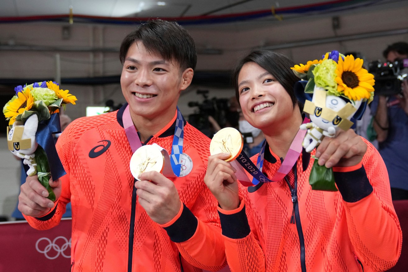 Japanese judoka Abe Hifumi (L) and Uta show their gold medal at Nippon Budokan in Chiyoda Ward, Tokyo on July 25, 2021. Hifumi and Uta become the first Japanese siblings to earn the gold medal on the same day in Olympic history. Uta won the women's -52kg, and her brother Hifumi won the men's -60kg, respectively. ( The Yomiuri Shimbun via AP Images )