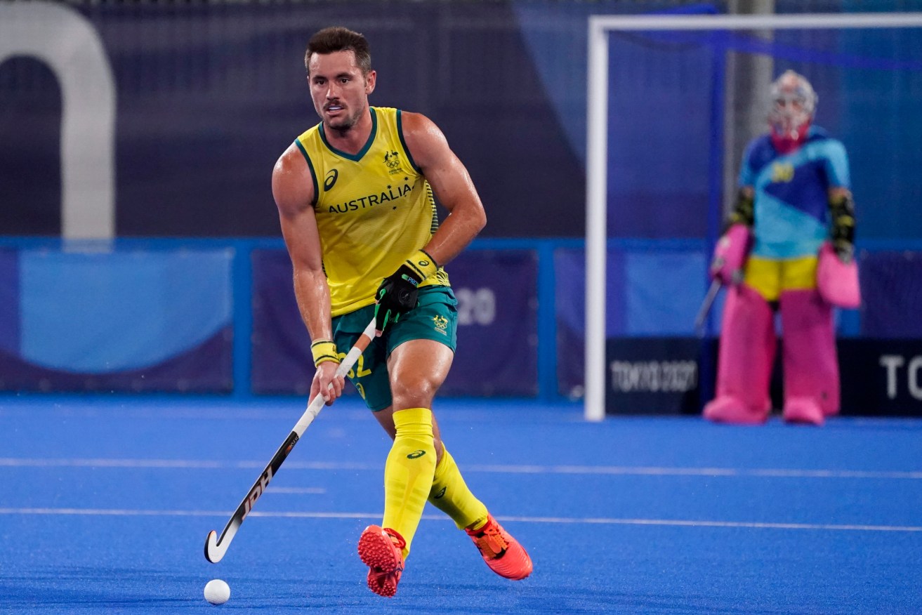 Australia's Jeremy Thomas Hayward runs the ball up the pitch during a men's field hockey match against New Zealand at the 2020 Summer Olympics, Wednesday, July 28, 2021, in Tokyo, Japan. (AP Photo/John Minchillo)