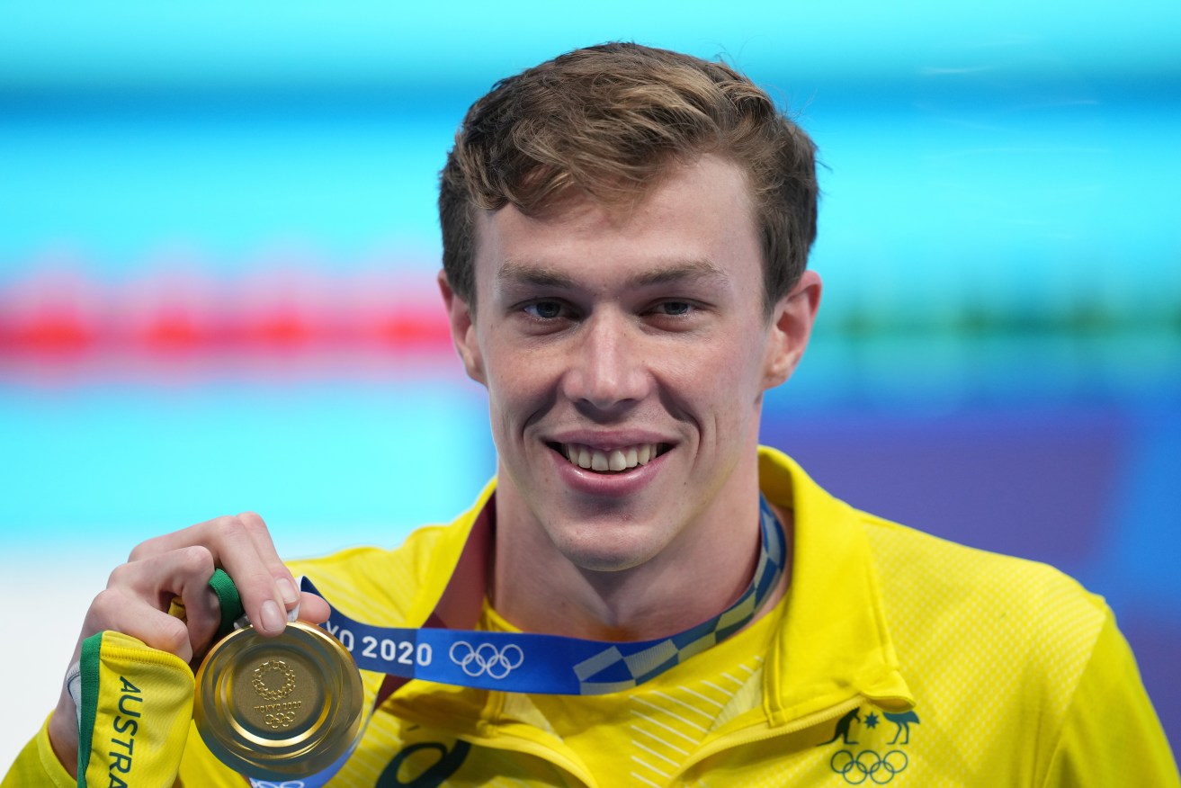 Zac Stubblety-Cook of Australia poses for as photograph after being presented with the gold medal for the men’s 200m breaststroke final. (AAP Image/Joe Giddens) 