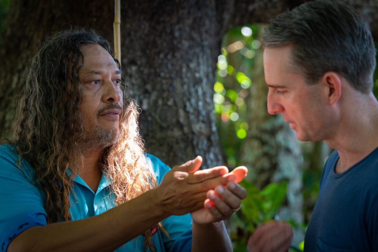 Kuku Yalanji man Linc Walker shows local bush medicine to Port Douglas pharmacist Brad Reilly. (Supplied)