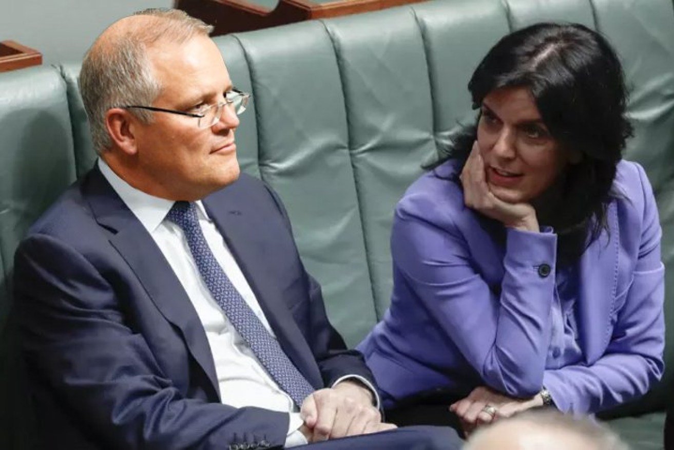 Former Liberal MP Julia Banks pictured in Parliament with Prime Minister Scott Morrison. Banks has accused him of menacing, controlling behaviour and says it prompted her departure from politics (AAP image).