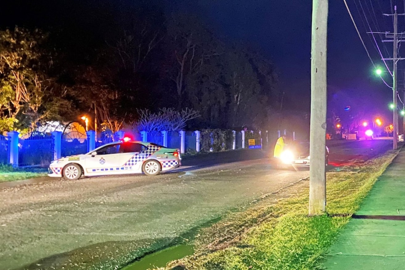 Police attending the scene of a wild street brawl in the Ipswich suburb of Booval, with multiple reports of shots fired in Baden Jones Way.(ABC News: Elizabeth Cramsie)