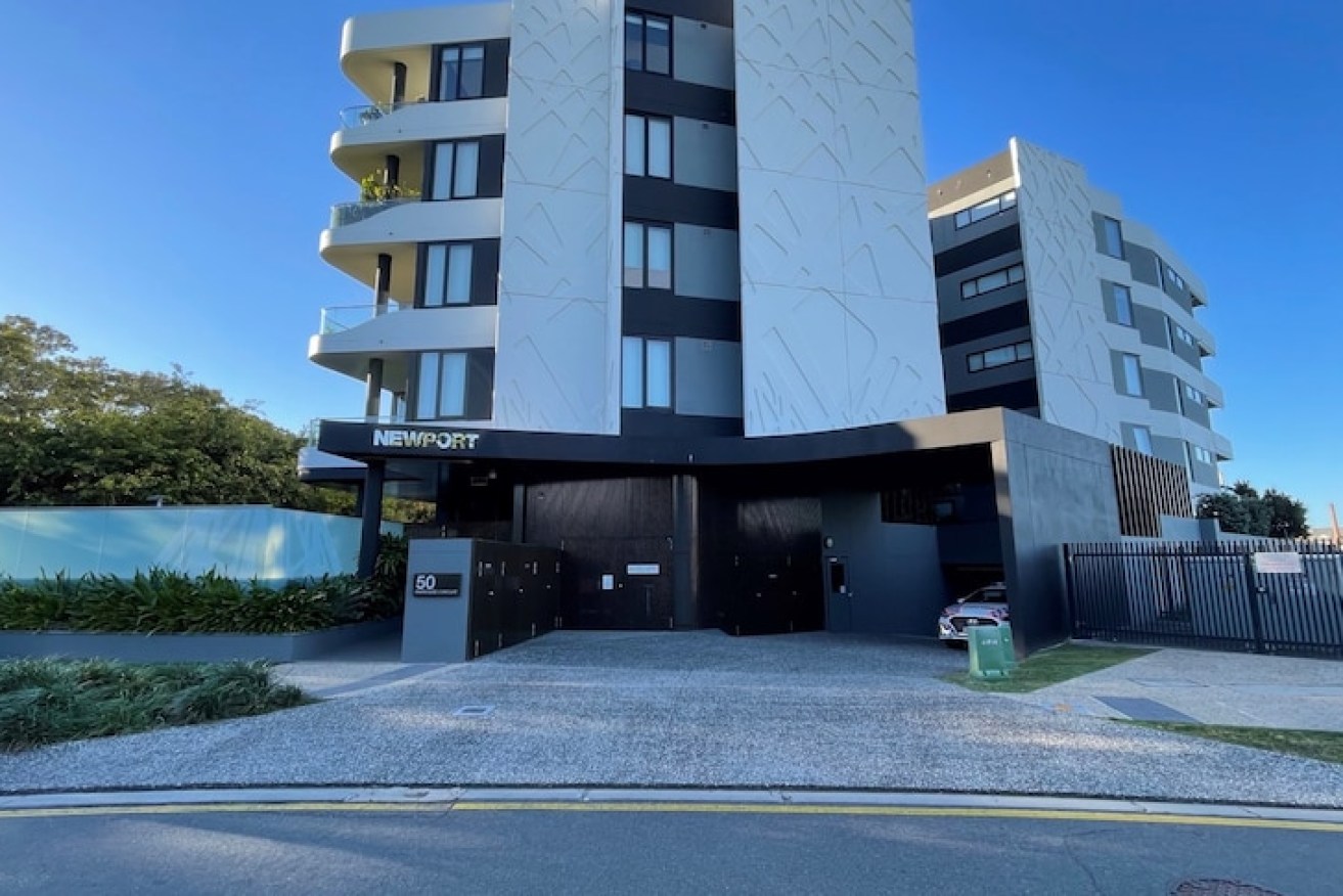 The luxury apartment building on the Brisbane River at Hamilton was found with a body in a box on the balcony (Photo: ABC).