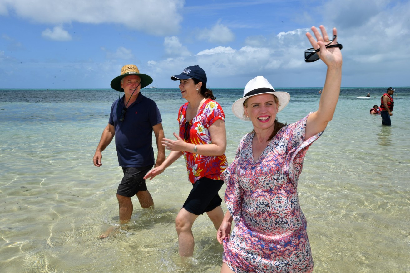Former Minister for Tourism Kate Jones (right) , pictured with ALP candidate for Cairns, Michael Healy and Queensland Premier Annastacia Palaszczuk  on Green Island in the Great Barrier Reef. Jones is running a new project aimed at saving the reef.  (AAP Image/Darren England) 