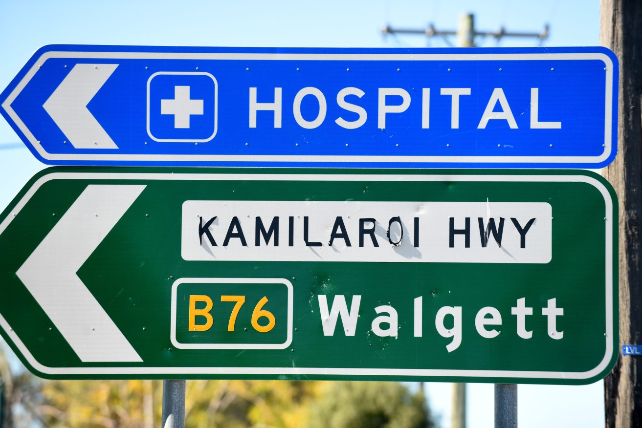 The sign to Walgett, now in lockdown, in a file picture from Bourke, which is also in lockdown.  The Greater Sydney outbreak has spread to regional NSW and again threatens Queensland. (AAP Image/Mick Tsikas) 