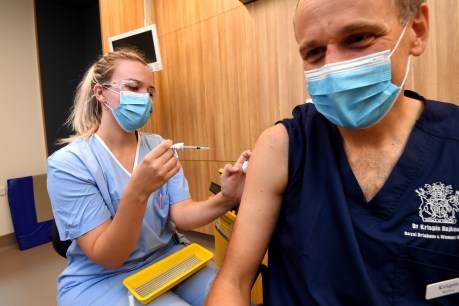 Covid wave begins as Queenslanders take the plunge on flu jabs