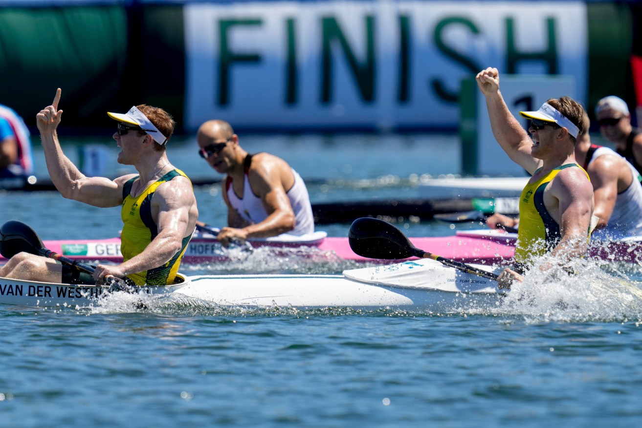 Jean van der Westhuyzen, and Thomas Green, of Australia, celebrate after winning the Toky Olympics men's kayak double 1000m final. (AP Photo/Kirsty Wigglesworth)